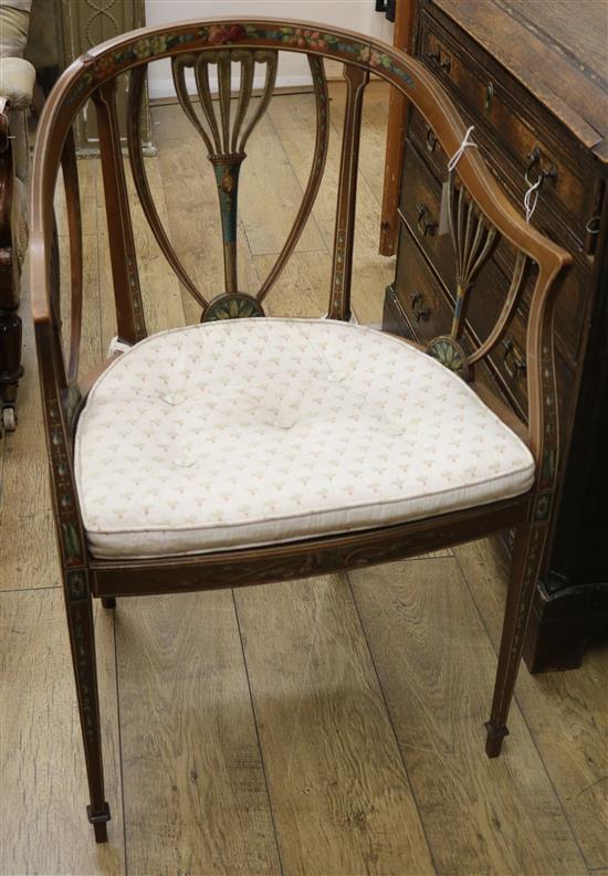 A painted satinwood tub chair